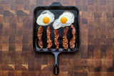 Square black Lodge Classic grill plate, 27.9 cm, durable cast iron cooking surface for outdoor grilling and searing.