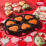 Lodge Classic 6-heart black cake pan, non-stick baking mold for heart-shaped cakes, durable and easy to clean.