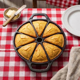 Set of eight black Lodge backform baking pans with classic design, ideal for baking and dessert preparation.