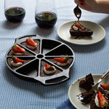 Lodge classic black baking pans set with 8 pieces, including various shapes for oven baking and cooking.