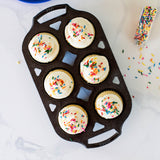 Black Lodge muffin pan with classic design, non-stick surface, and multiple muffin cups for baking delicious muffins.