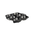 Lodge classic black cake mold with six skull-shaped cavities for creative baking and decorative desserts.