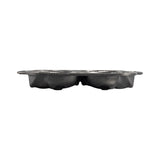 Lodge black cake pan with six skull-shaped molds for baking themed desserts, made of durable material.