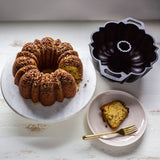 Lodge classic black cake pan with a sturdy round design, ideal for baking cakes and desserts.