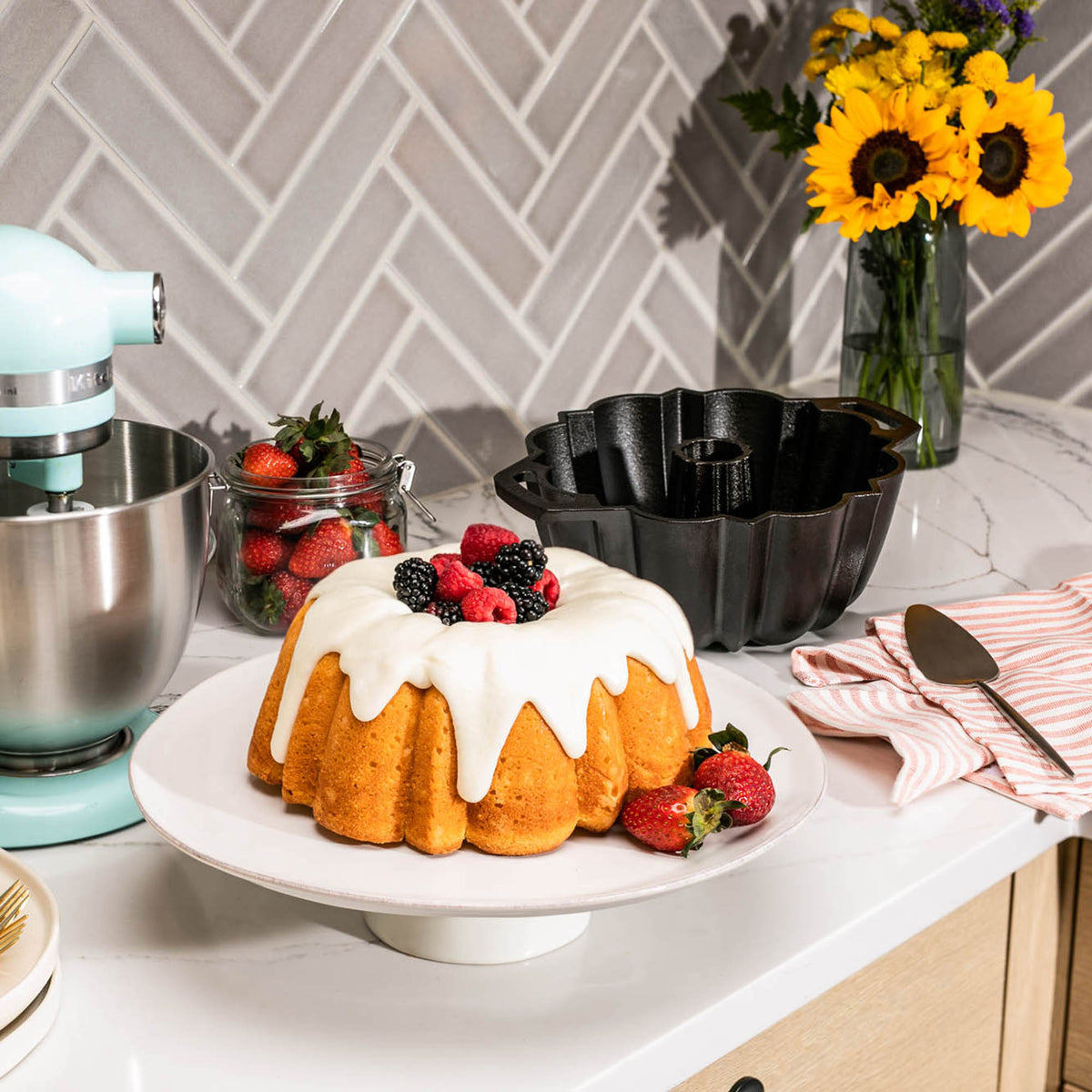 Lodge classic black cake pan with a smooth, round shape and sturdy metal construction for baking delicious cakes.