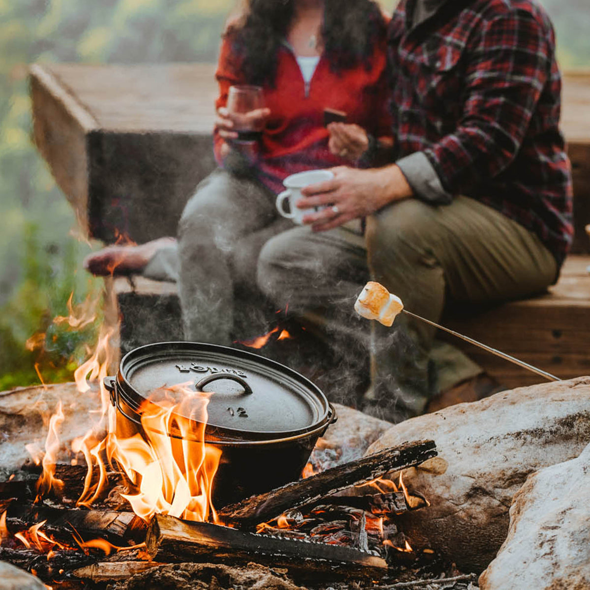 Lodge Classic black grill with a sturdy metal frame and cooking surface, suitable for outdoor grilling and barbecues.