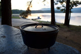 Lodge Classic black grill with a sturdy metal frame and cooking grate, perfect for outdoor grilling and barbecues.