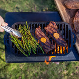 Black Lodge Sportsman’s Pro grill with sturdy construction, cooking surface, and control knobs for outdoor grilling.