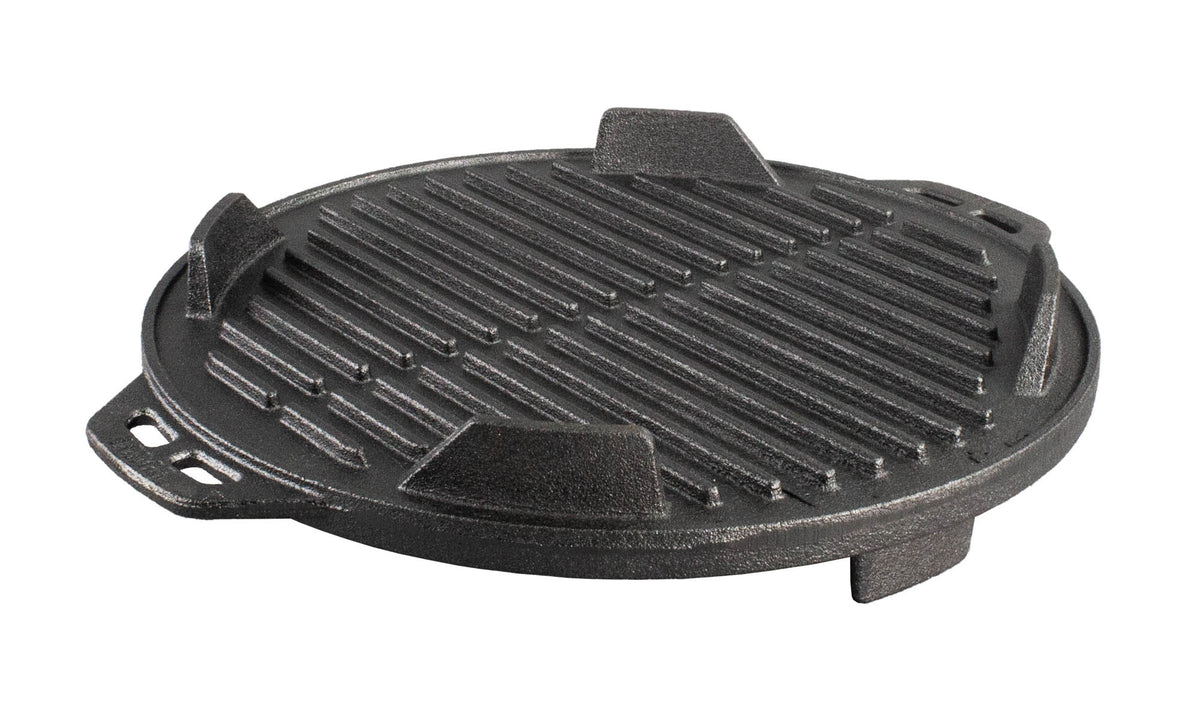 Lodge black 30.5 cm cast iron grill with textured cooking surface and raised edges for even grilling.