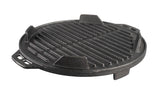Lodge black 30.5 cm cast iron grill with textured cooking surface and raised edges for even grilling.