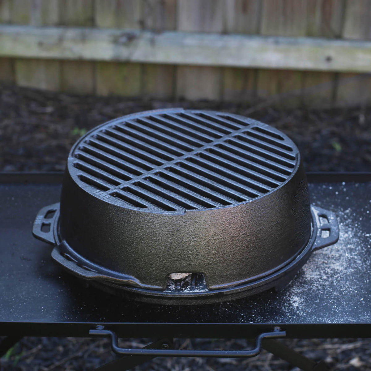 Lodge black 30.5 cm cast iron grill pan with textured cooking surface and sturdy handle for outdoor or indoor use