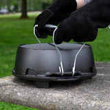 Lodge black 30.5 cm cast iron grill with ridged cooking surface and sturdy handle, ideal for outdoor grilling and grilling indoors.