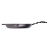 Black Lodge Chef cast iron skillet showing smooth cooking surface and sturdy handle for versatile kitchen use.