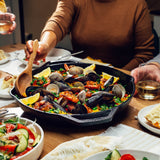 Lodge cast iron double handle skillet with chef's style, 35.6 cm diameter, used for versatile cooking and searing.