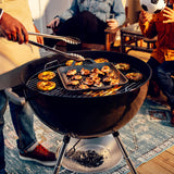 Lodge black cast iron wok with 32 cm diameter, designed for high-heat cooking and stir-frying in the kitchen.