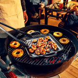 Black LODGE cast iron wok, 32 cm size, with a sturdy handle, ideal for stir-frying and cooking on various stovetops.