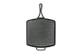 Lodge black square grill pan with 30.5x30.5 cm cooking surface, durable cast iron cookware for grilling and searing.