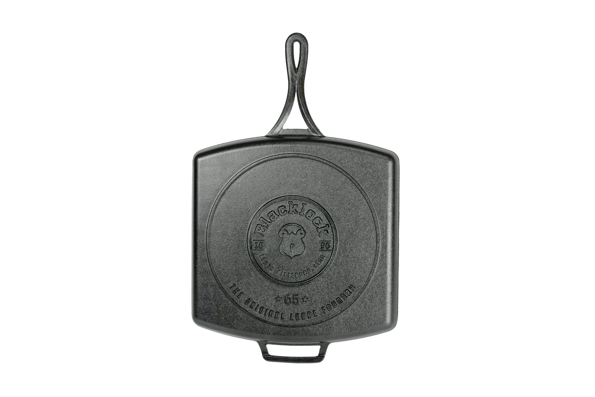 Lodge black square cast iron grill pan with 30.5 x 30.5 cm cooking surface for grilling and searing.