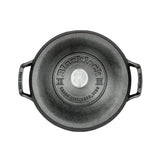 Lodge black cast iron skillet with a 5.2-liter capacity, featuring a sturdy handle and smooth cooking surface.