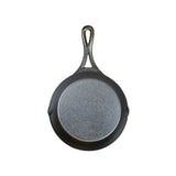 Lodge black cast iron pan with 18 cm diameter, featuring a sturdy handle and smooth cooking surface.
