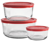 Anchor Hocking SnugFit food storage container with clear plastic lid and rectangular glass body showing inside contents.