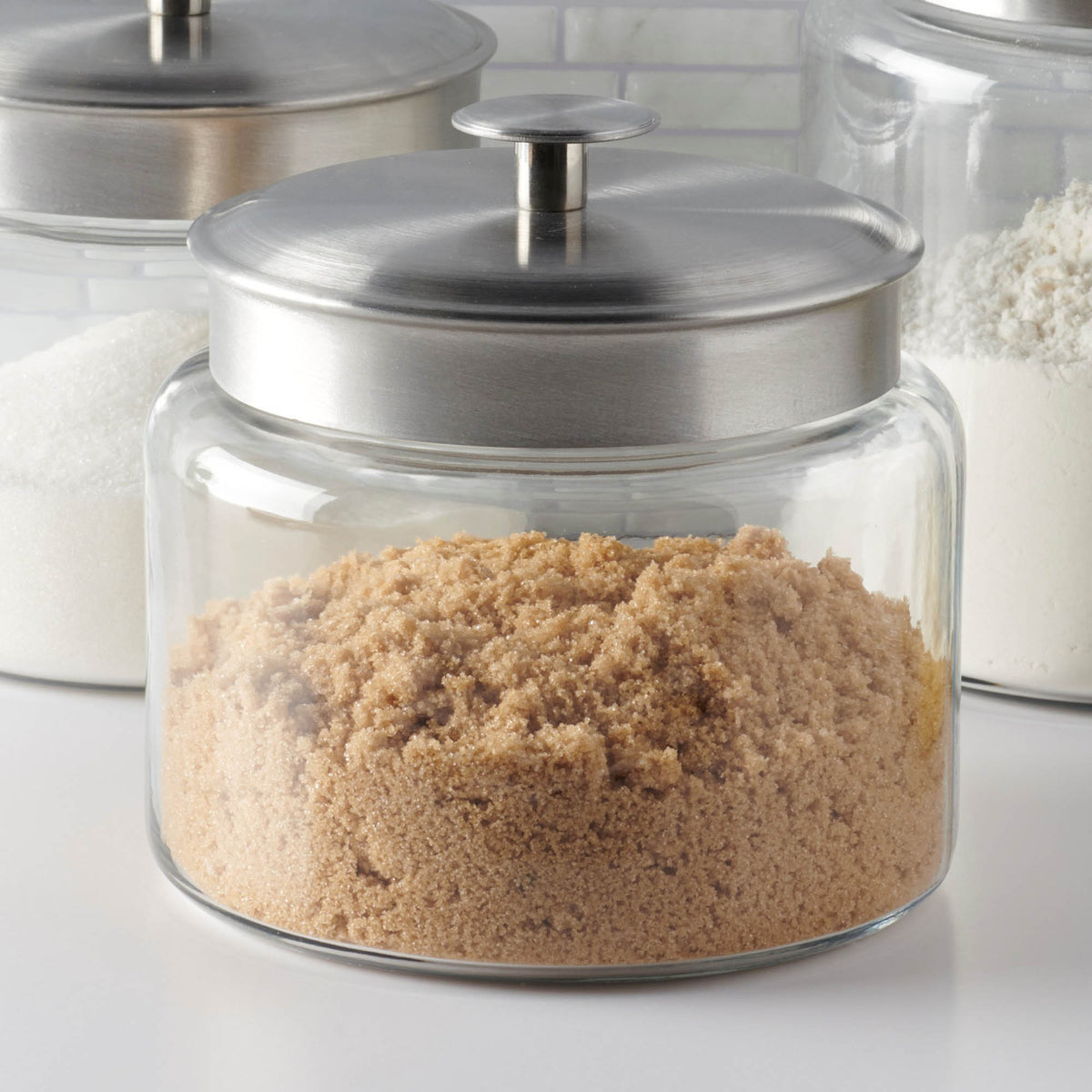 Anchor Hocking Montana storage jar with clear glass body and airtight lid, ideal for kitchen organization and food storage.