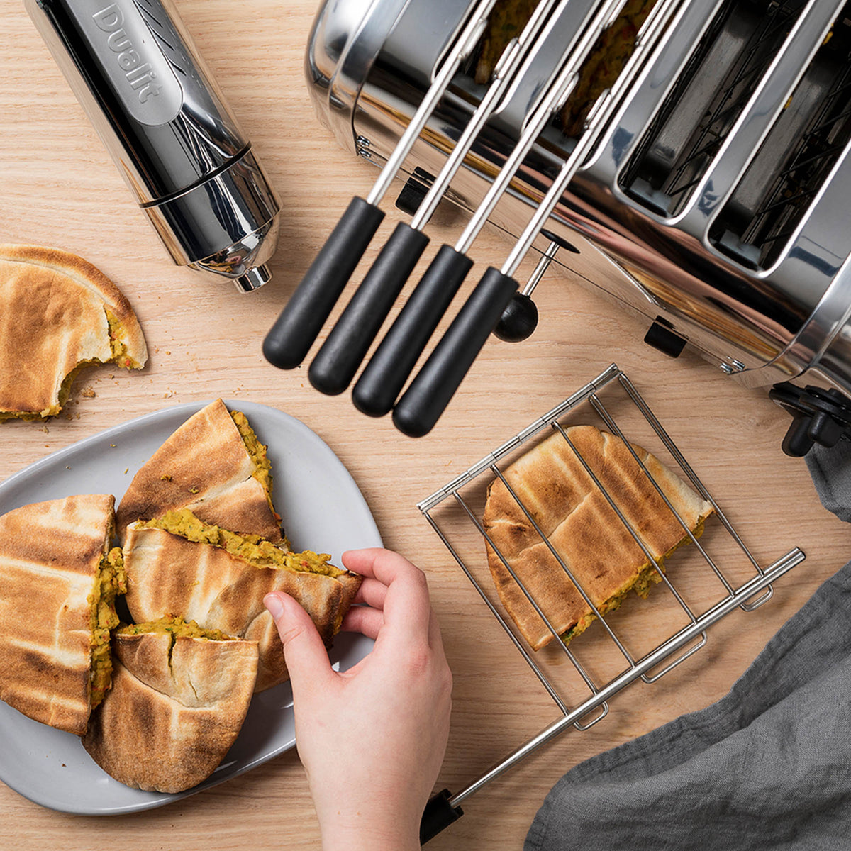 Dualit Classic stainless steel sandwich maker with non-stick plates and compact design for quick, even toasting.