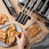 Dualit Classic stainless steel sandwich maker with non-stick plates and compact design for quick, even toasting.
