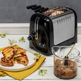 Dualit sandwichmaker LITE with stainless steel exterior, showing closed device and textured handle for easy grip.