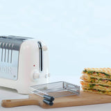 Dualit Lite stainless steel sandwich maker with open plates, ready for making toasted sandwiches.