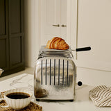 Dualit Classic stainless steel warmhalteplatte with smooth surface and sleek design for keeping food warm.