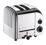 Dualit Newgen polished 2-slice toaster with modern design and stainless steel finish, showcasing bread slices inside.