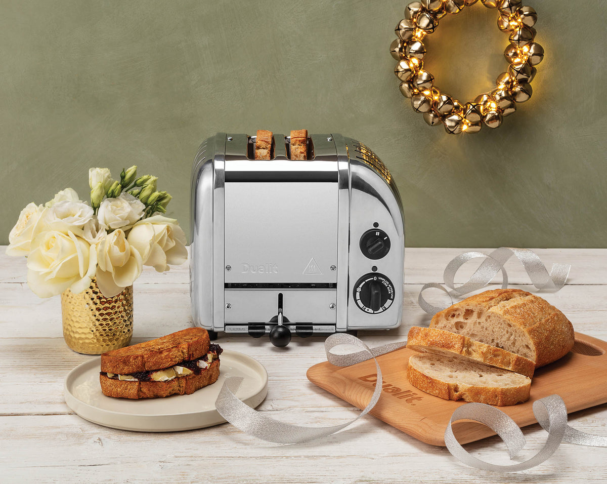Dualit Newgen polished 2-slice toaster with sleek design and control buttons, perfect for toasting bread slices evenly.