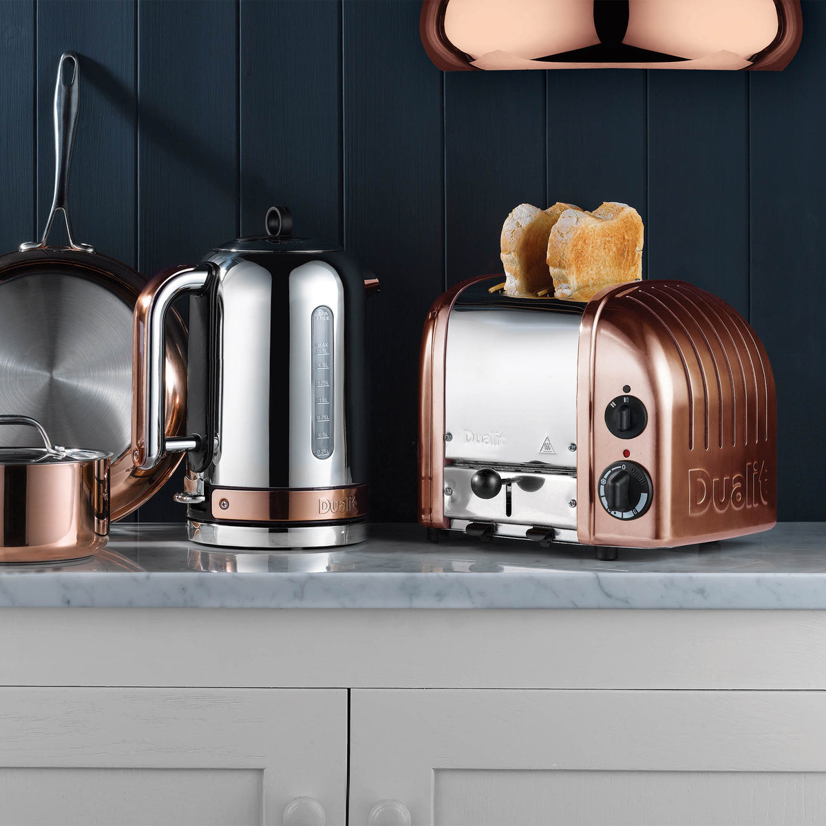 Dualit Newgen copper toaster with two slots, modern design, featuring a sleek metallic finish and four control dials.