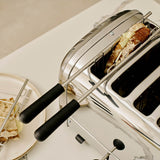 Dualit Classic stainless steel toaster with six slots, designed for toasting bread evenly.