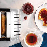 Dualit NewGen white 4-slice toaster with modern design and control knobs, ideal for toasting bread and bagels.