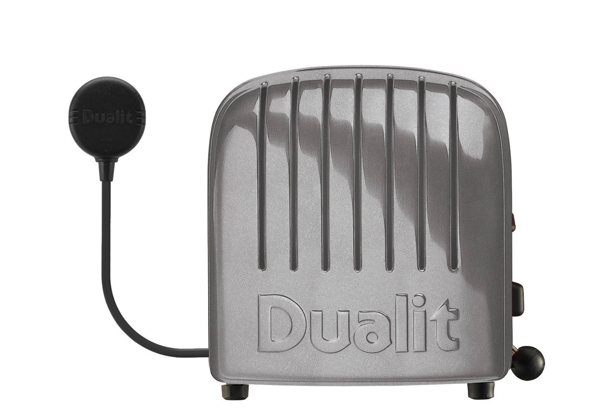 Dualit NewGen silver metallic 4-slice toaster with modern design and push-button controls.