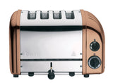 Dualit NewGen copper 4-slice toaster with modern design, featuring shiny copper finish and toast slots for quick breakfast preparation.