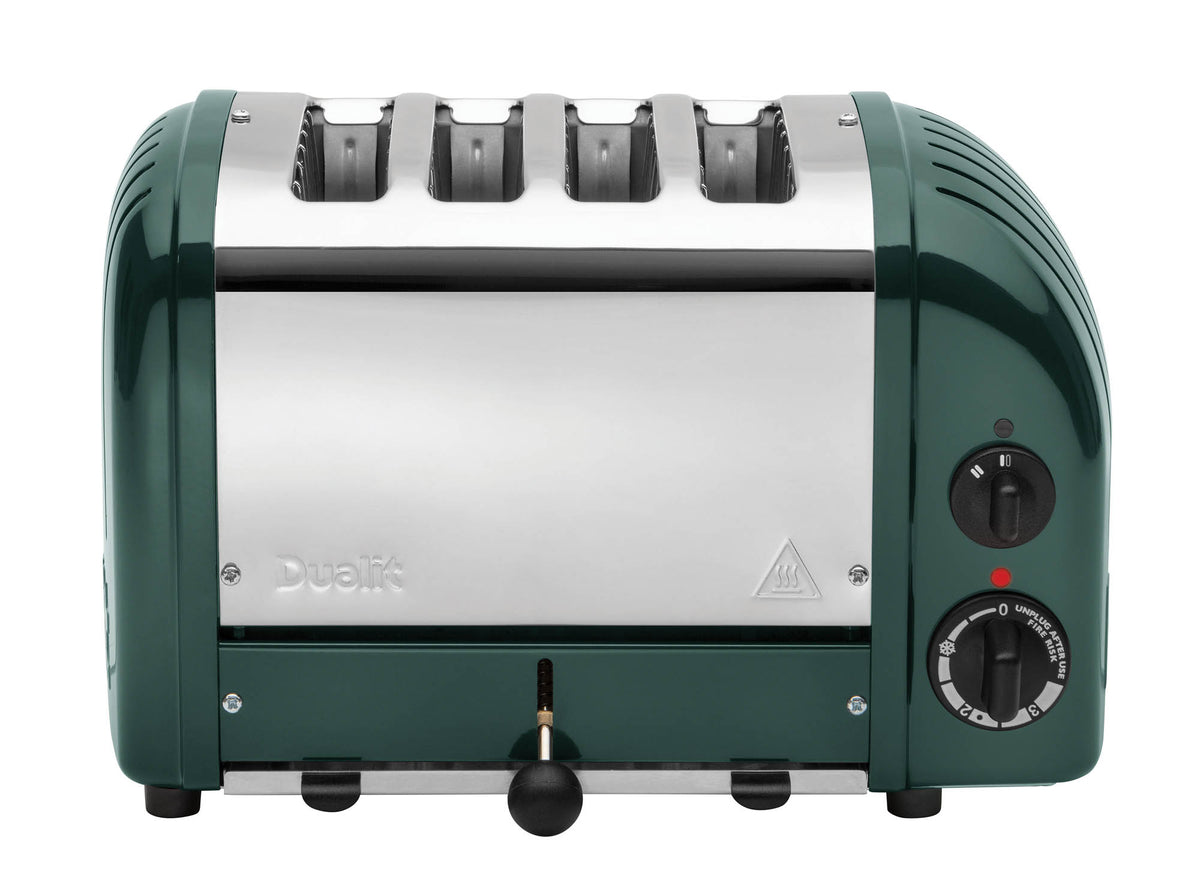Dualit Newgen 4-slice evergreen toaster with modern design and control knobs, shown in a kitchen setting.