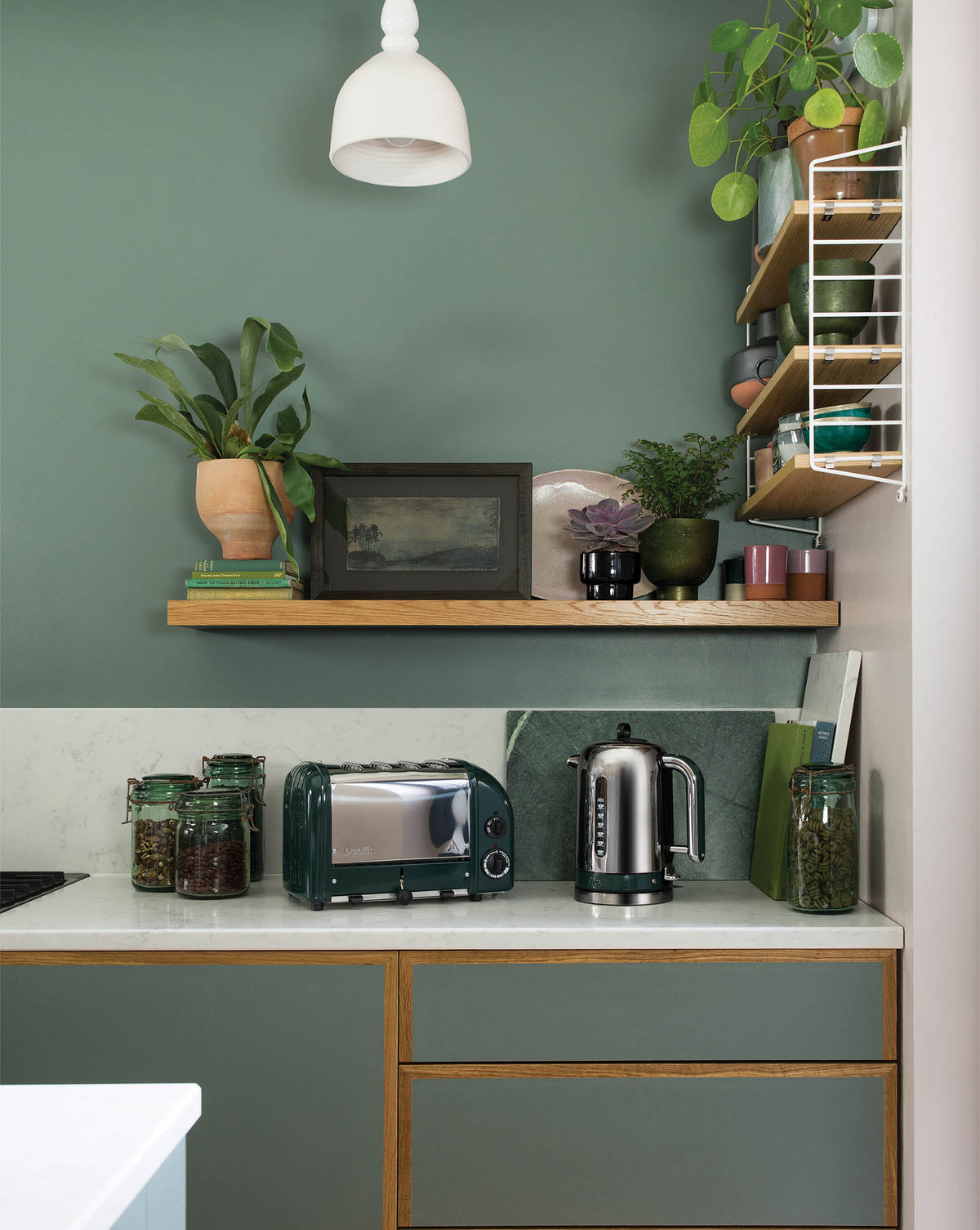 Dualit Newgen 4-slice evergreen toaster with sleek design and modern controls, ideal for toasting bread and bagels.