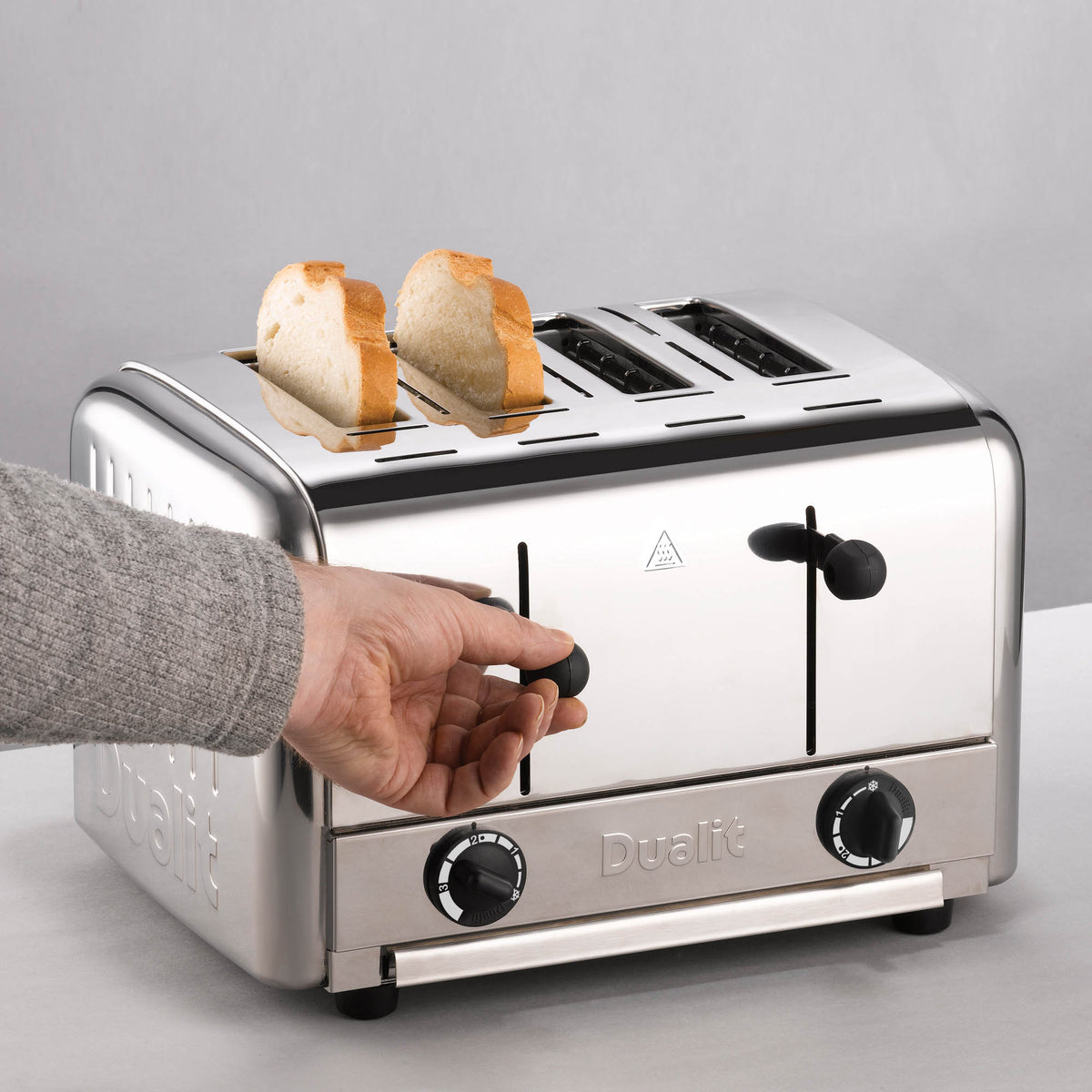 Dualit Gastro black pop-up toaster with two slots, featuring a sleek design and control buttons for toasting bread.