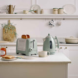 Dualit LITE electric kettle in sage green with 1.5-liter capacity, featuring a sleek stainless steel design and ergonomic handle.