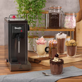 Dualit CINO milk frother for catering, stainless steel milk foamer with ergonomic handle and versatile frothing options.