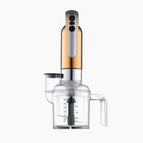 Dualit Classic copper hand blender with stainless steel blending shaft and ergonomic handle, displayed on a kitchen countertop.