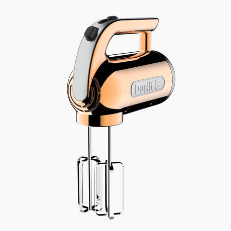 Dualit Classic copper hand mixer with beaters and control dial, ergonomic design for baking and mixing tasks.