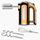 Dualit Classic copper handmixer with stainless beaters and ergonomic handle, designed for efficient mixing and durability.