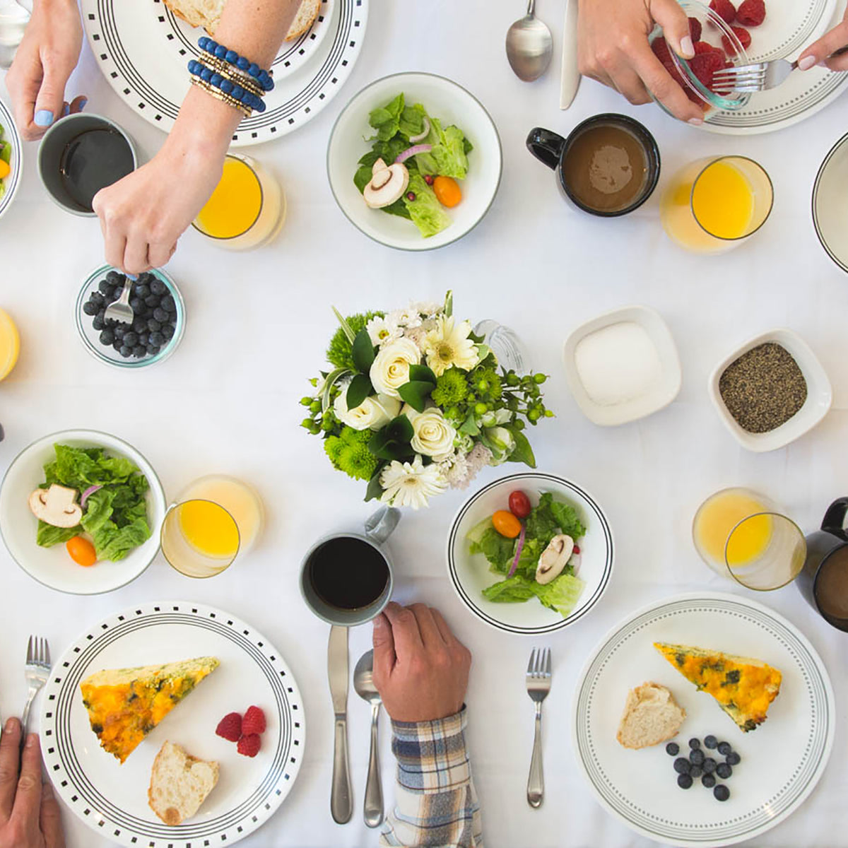 Corelle CITY BLOCK white dinnerware set with plates and bowls arranged on a table, showcasing modern ceramic dishware design.