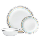 Corelle Paloma white dishware set with colorful graphic design, showcasing plates and bowls in a stylish kitchen setting