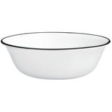 Corelle Paloma white dinnerware set with colorful graphic design, showcasing plates and bowls on a clean background.