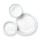 Corelle Country Cottage white dinnerware service with plates, bowls, and cups arranged on a table.